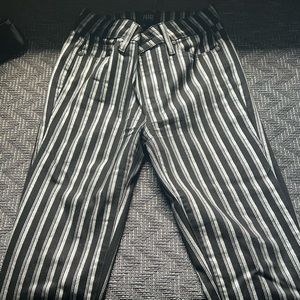 Silver and black bootcut jeans by PAIGE.